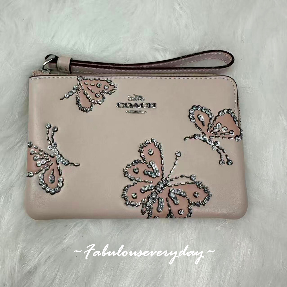 Coach Corner Zip Wristlet With Sparkly Butterfly Print In Leather/Seashell CCJ72